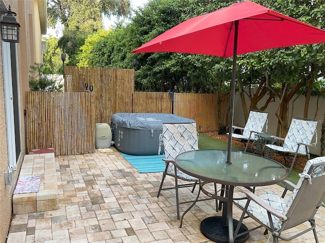 view of patio / terrace featuring a hot tub