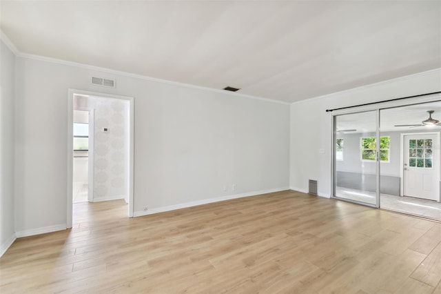 spare room with crown molding, light hardwood / wood-style flooring, and ceiling fan