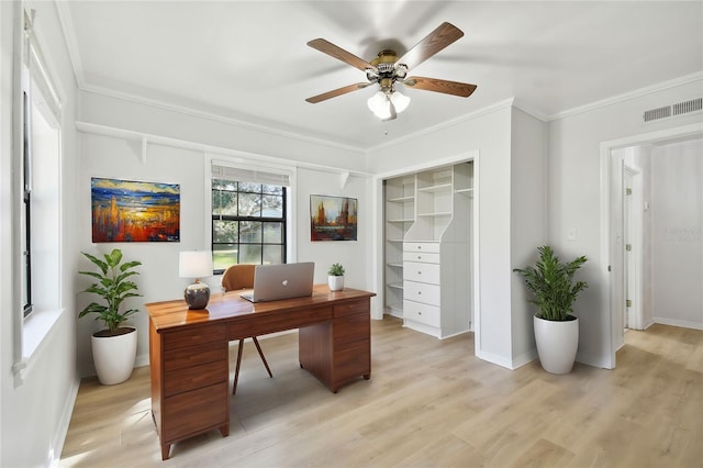 office space featuring crown molding, light hardwood / wood-style flooring, and ceiling fan