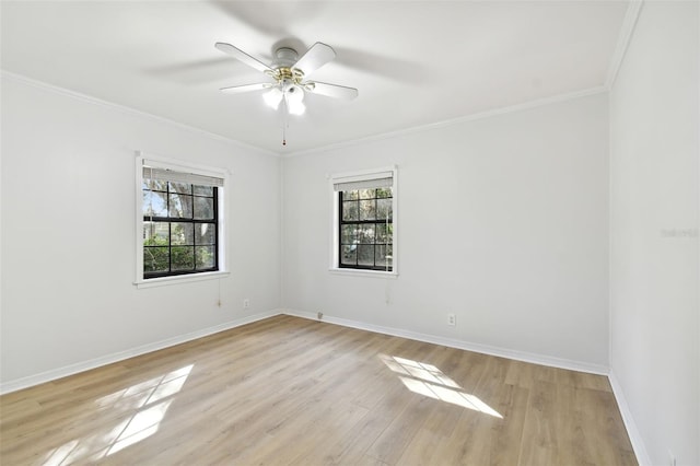 empty room featuring light hardwood / wood-style flooring, a healthy amount of sunlight, ceiling fan, and crown molding