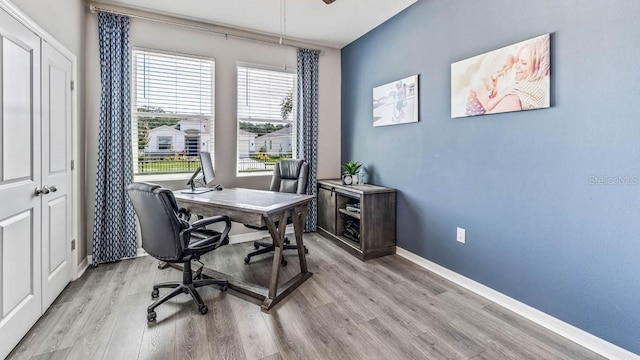 office area featuring ceiling fan and light wood-type flooring