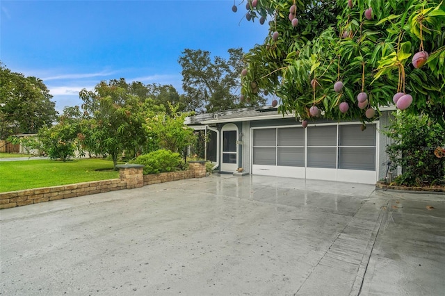 garage featuring a lawn