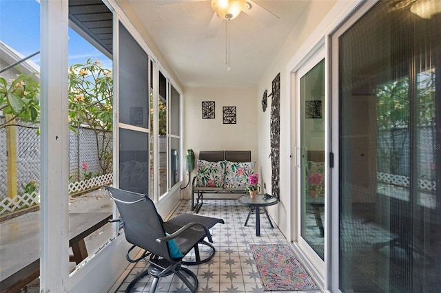 sunroom / solarium with ceiling fan