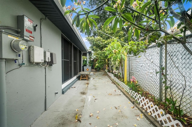 view of side of property featuring a patio area