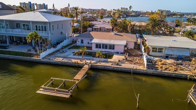 rear view of property with a water view and a patio area