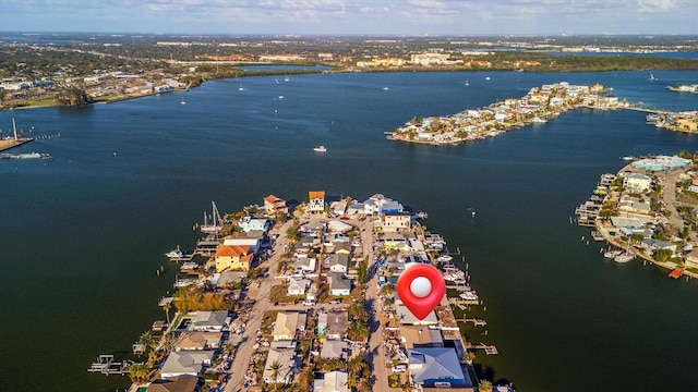 birds eye view of property featuring a water view