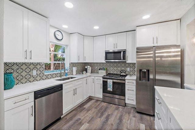 kitchen with sink, white cabinets, and stainless steel appliances