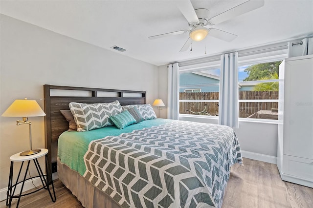 bedroom featuring hardwood / wood-style flooring and ceiling fan