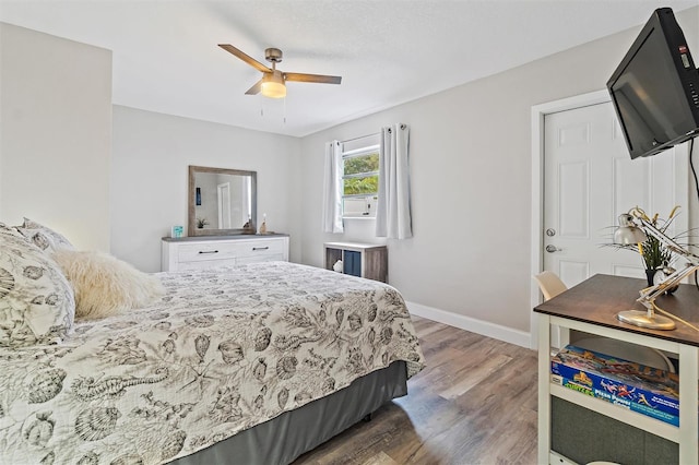 bedroom featuring dark wood-type flooring and ceiling fan