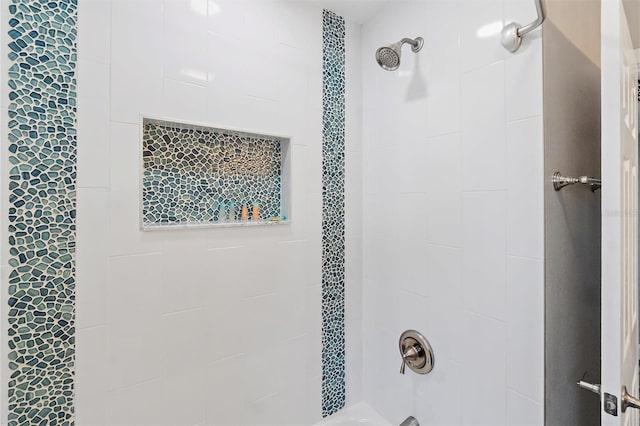 bathroom featuring tiled shower