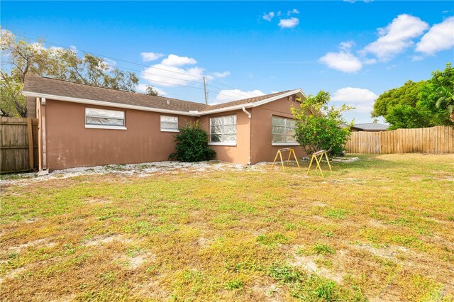 5621 Moog Rd, New Port Richey, FL 34652 - view of side of property featuring stucco siding