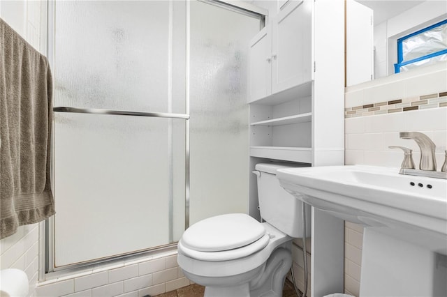 5621 Moog Rd, New Port Richey, FL 34652 - full bathroom with a stall shower, toilet, decorative backsplash, and a sink