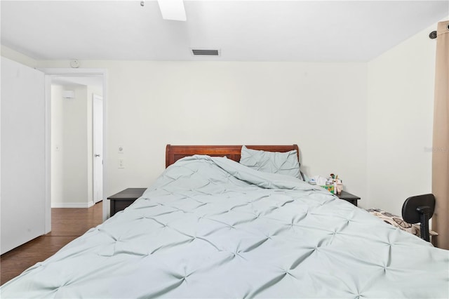 bedroom featuring ceiling fan and dark hardwood / wood-style flooring