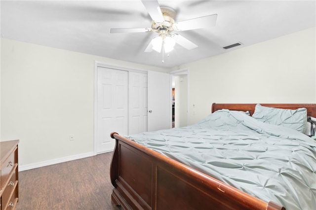 bedroom with a closet, ceiling fan, and dark hardwood / wood-style flooring