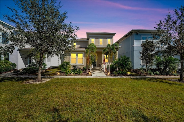 view of front of home with a yard