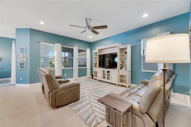 living room with light tile patterned floors and ceiling fan