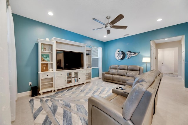 tiled living room with ceiling fan