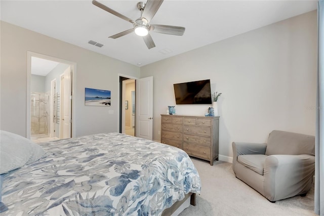 carpeted bedroom featuring ceiling fan and ensuite bathroom