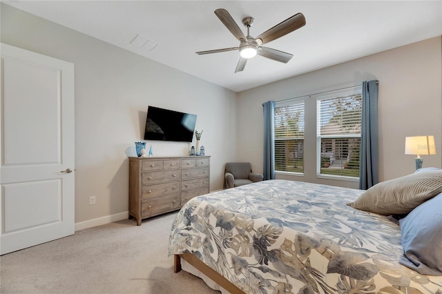 bedroom with light colored carpet and ceiling fan