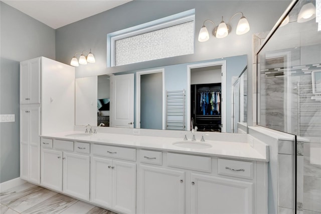 bathroom featuring vanity and walk in shower