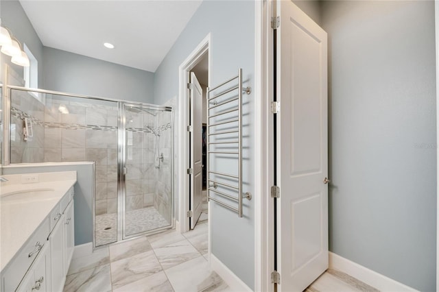 bathroom featuring vanity and an enclosed shower