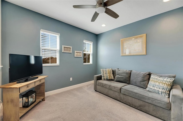 living room with ceiling fan and light colored carpet