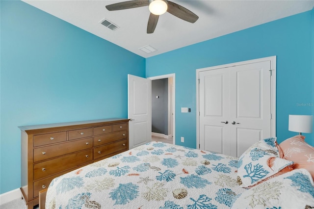 carpeted bedroom with a closet and ceiling fan