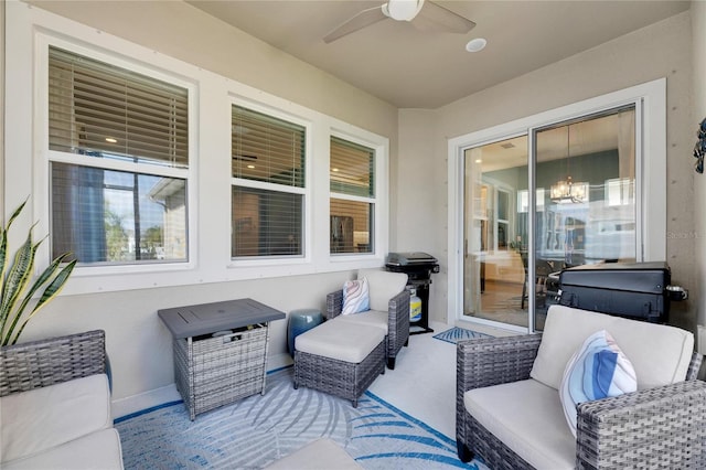 view of patio / terrace with area for grilling, ceiling fan, and outdoor lounge area