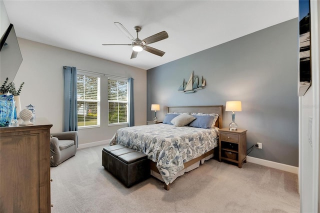 bedroom with light colored carpet and ceiling fan