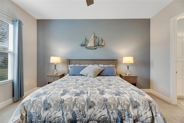 carpeted bedroom featuring ceiling fan