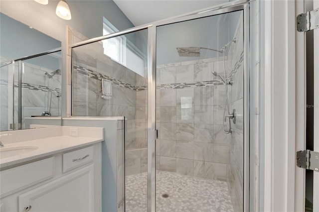 bathroom with vanity and walk in shower