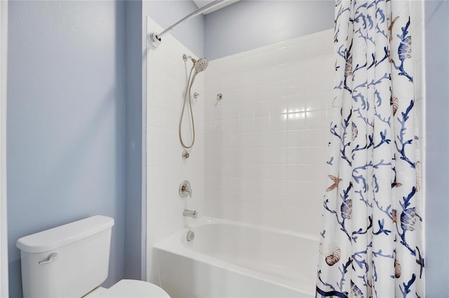 bathroom with shower / tub combo and toilet