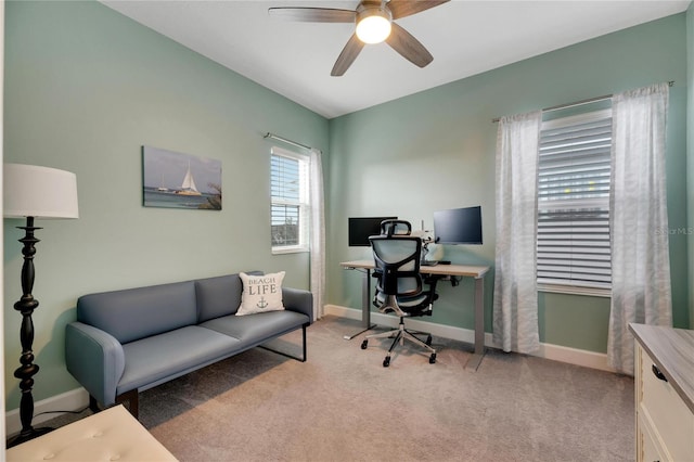 office area with light colored carpet and ceiling fan