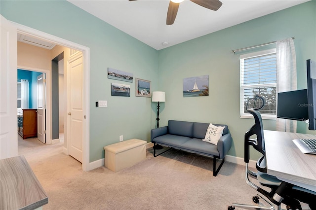 carpeted home office with ceiling fan