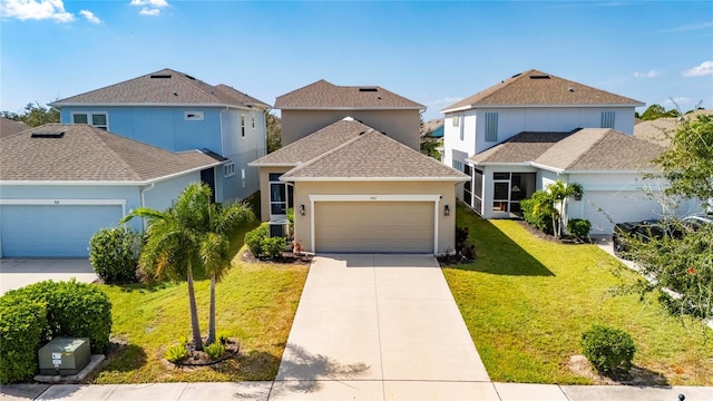 view of front property featuring a front yard, cooling unit, and a garage