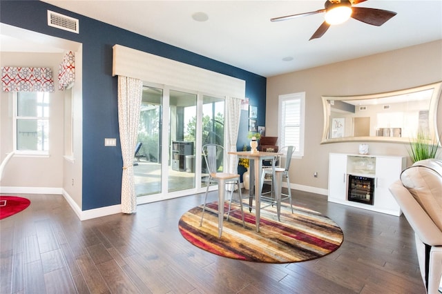 dining room featuring ceiling fan and dark hardwood / wood-style flooring