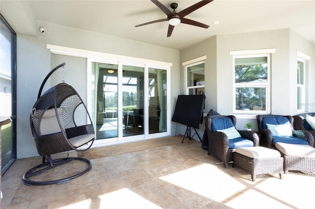 exterior space featuring ceiling fan