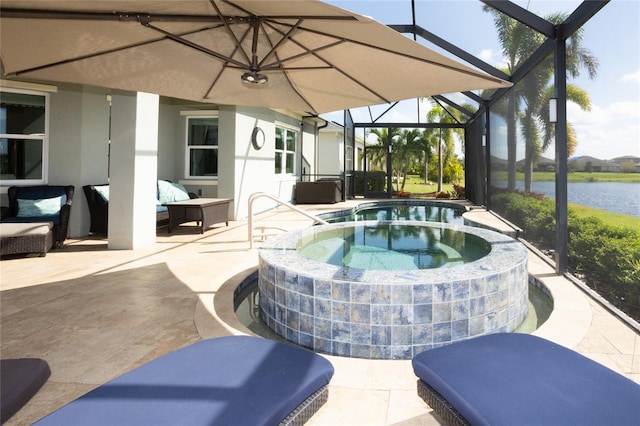 view of pool with a patio area, an in ground hot tub, a water view, and glass enclosure