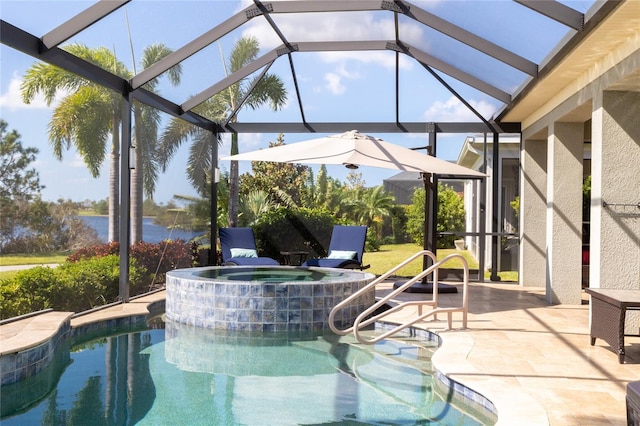 view of swimming pool with a patio, a lanai, and an in ground hot tub