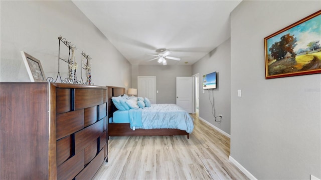 bedroom with light hardwood / wood-style flooring and ceiling fan