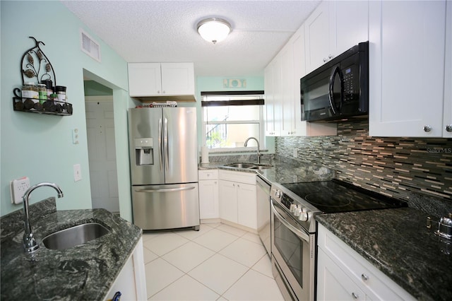 1901 Oyster Catcher Ln Unit 814, Clearwater, FL 33762 - kitchen with white cabinetry, appliances with stainless steel finishes, a sink, and visible vents
