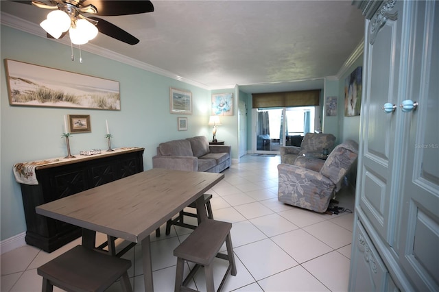 dining space featuring ornamental molding, ceiling fan, and light tile patterned floors