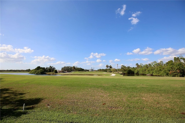 1901 Oyster Catcher Ln Unit 814, Clearwater, FL 33762 - view of home's community featuring a lawn, view of golf course, and a water view