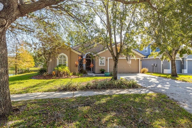 ranch-style house featuring a front yard and a garage