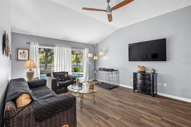 living room with ceiling fan, dark wood-type flooring, and vaulted ceiling