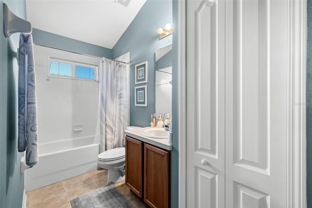 full bathroom featuring lofted ceiling, toilet, tile patterned flooring, vanity, and shower / bathtub combination with curtain