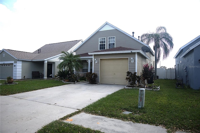 view of front of house featuring a front yard and a garage