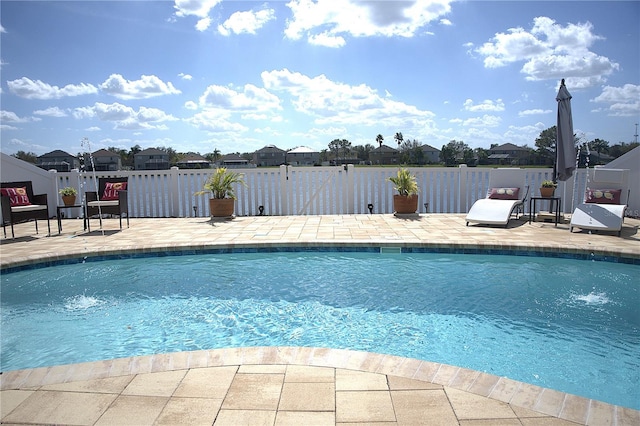 view of swimming pool with a patio area