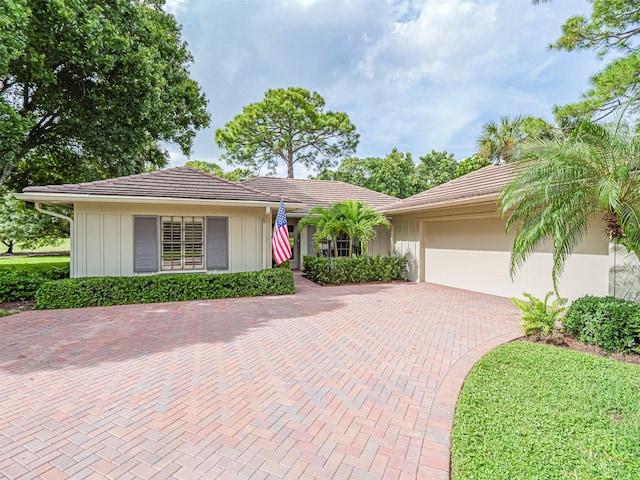 single story home with a garage