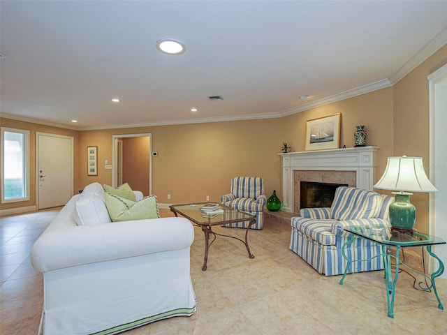 living room featuring crown molding, light tile patterned floors, and a fireplace